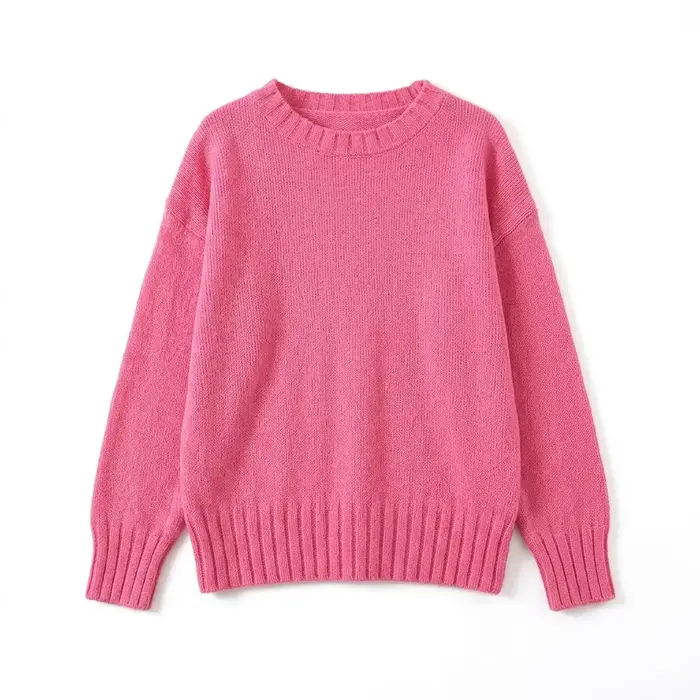 Un haut en tricot élégant, ample, léger et à col rond, de couleur rose pâle, parfait pour le printem