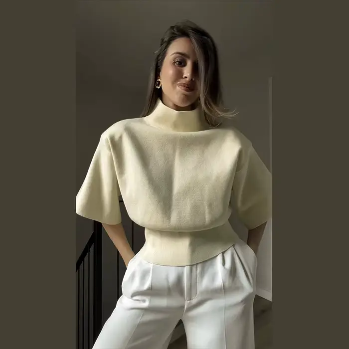 Blouse pull femme en maille côtelée, col montant, sans manches, avec volants aux épaules et taille a